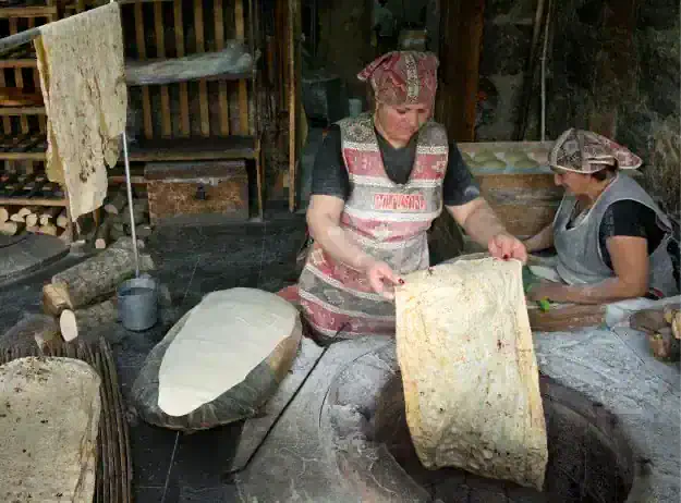 Lavash baking in a tonir